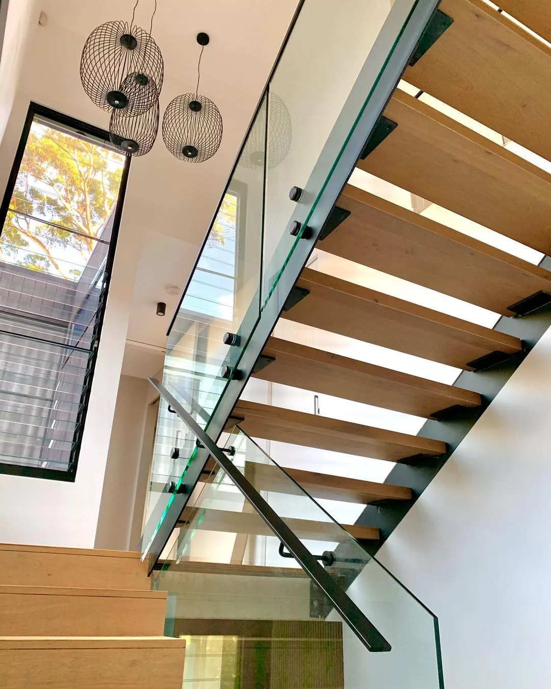 Face fixed frameless glass balustrade with side mount handrail