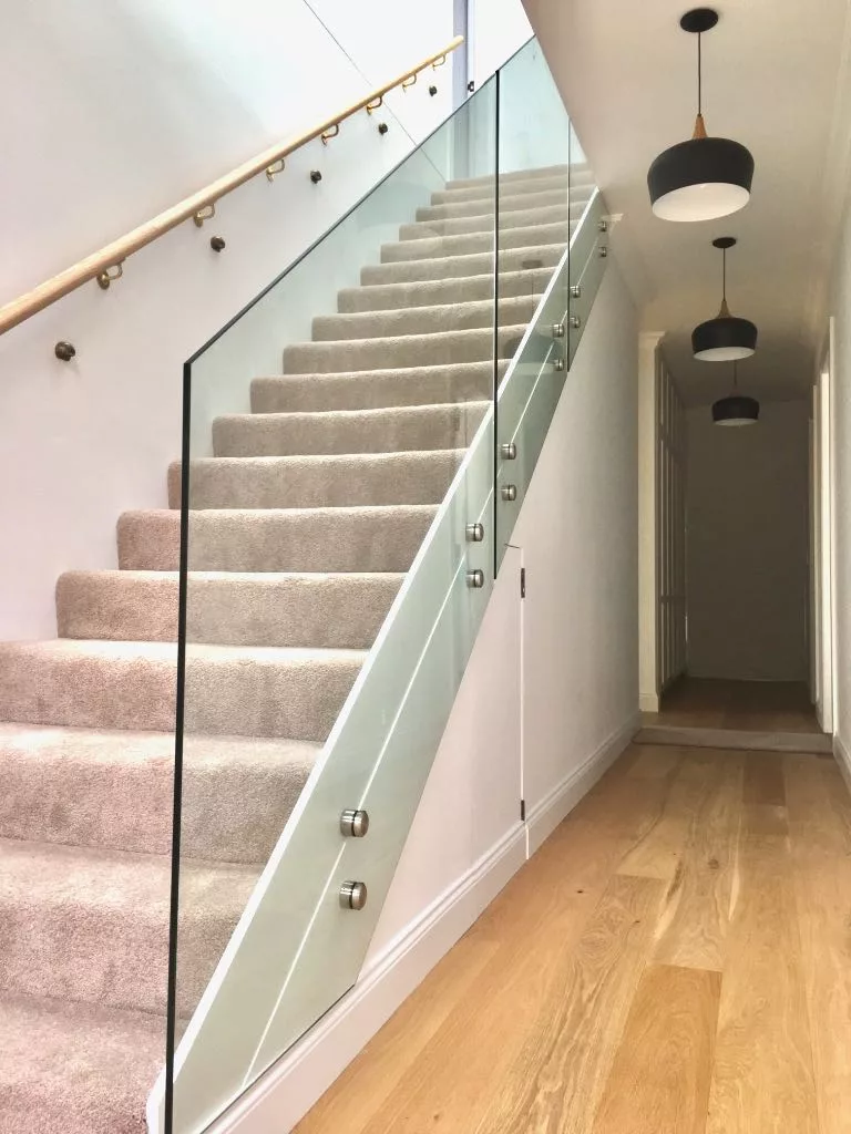 Frameless glass balustrade with polished chrome fittings