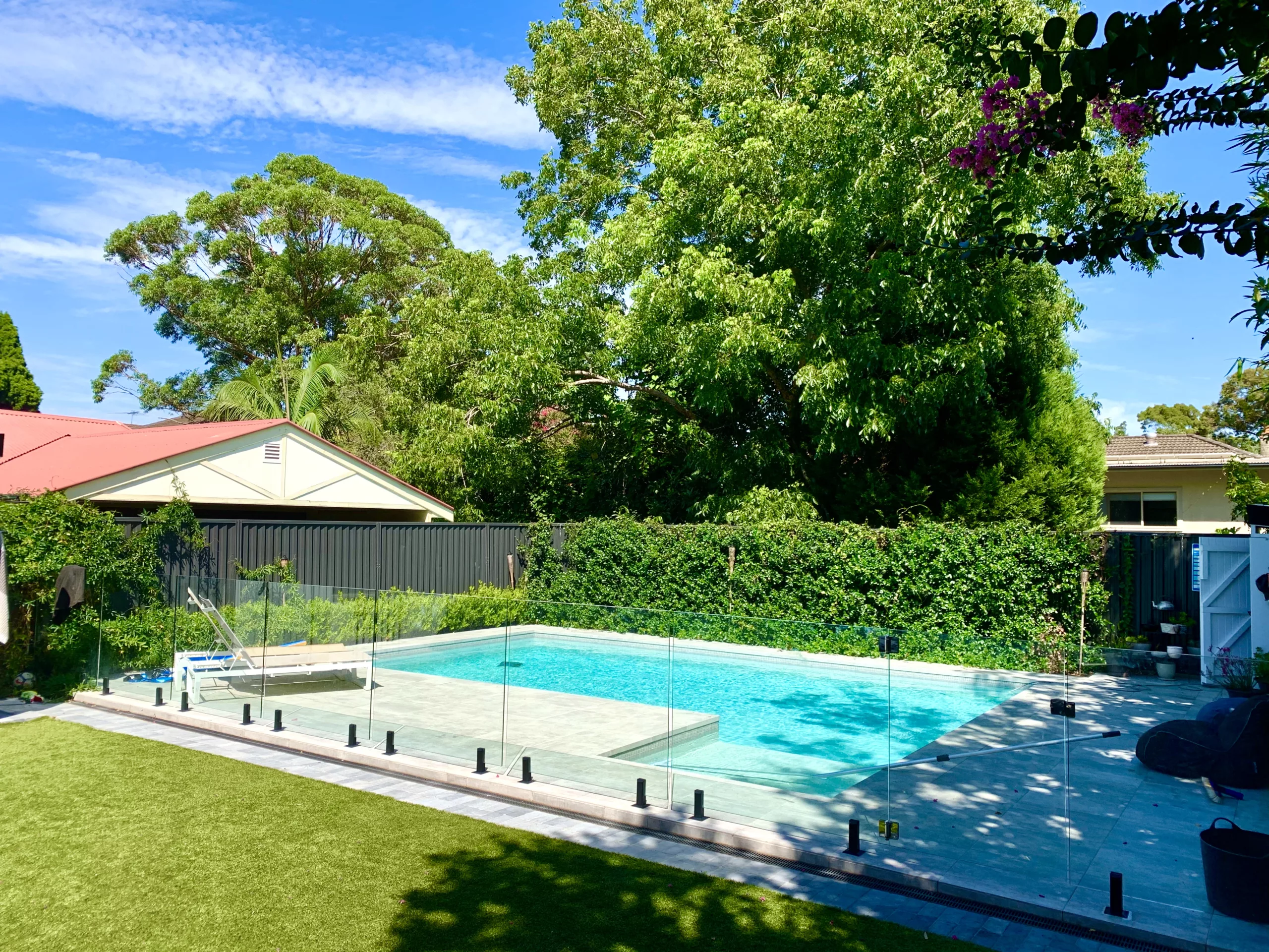 Glass pool fence in custom powder coated spigots