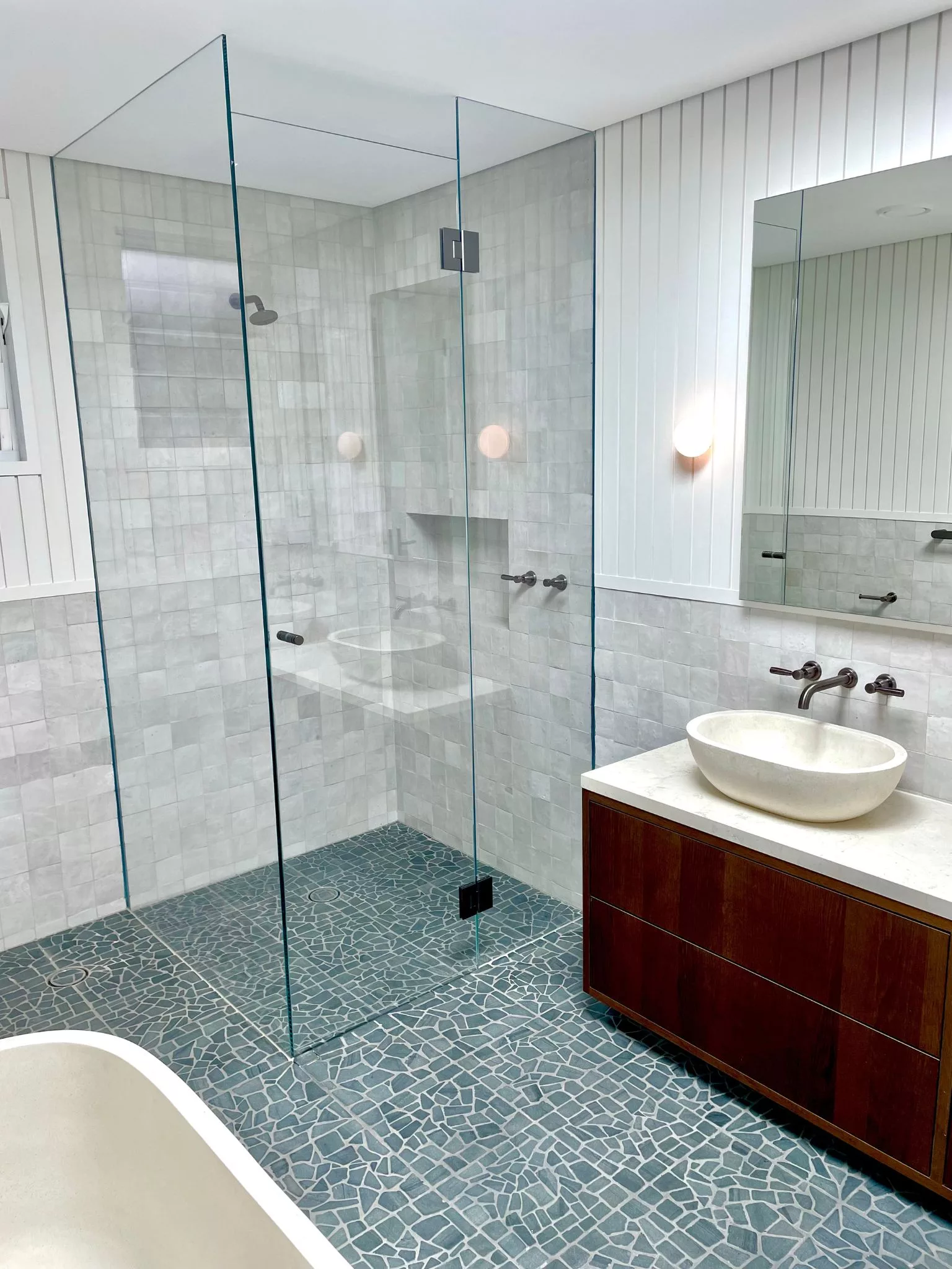Floor to ceiling frameless glass corner shower screen